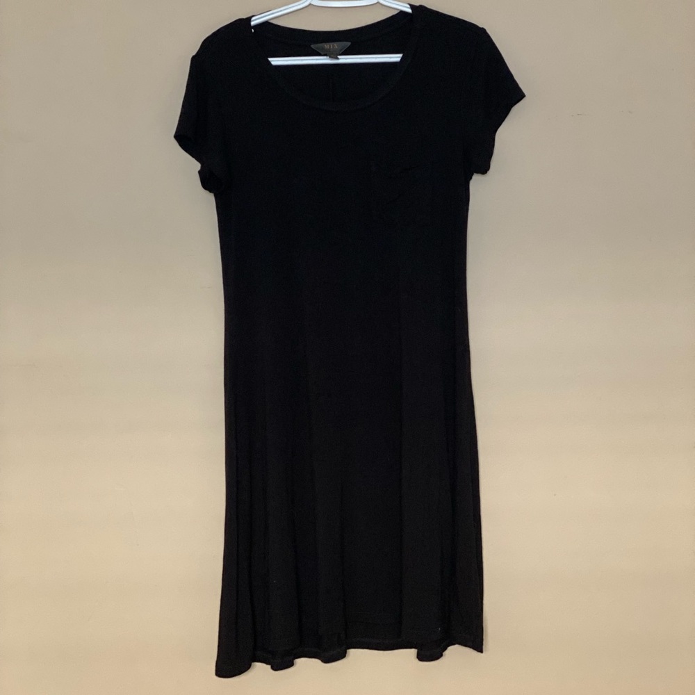 Black t-shirt dress with a pocket on the front. Cotten and spandex material.